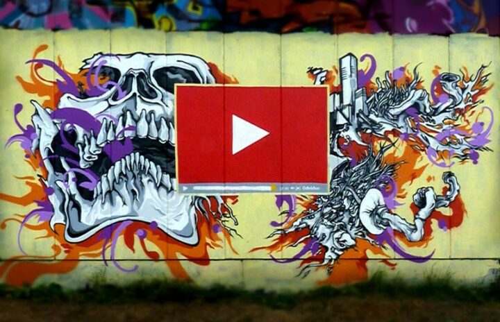 odvideo a skullhead and a video player paint on a wall