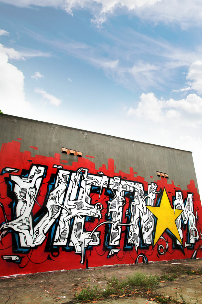 Alex Kanos made a mural in Saigon Vietnam letters paint on a wall in ho chi minh city