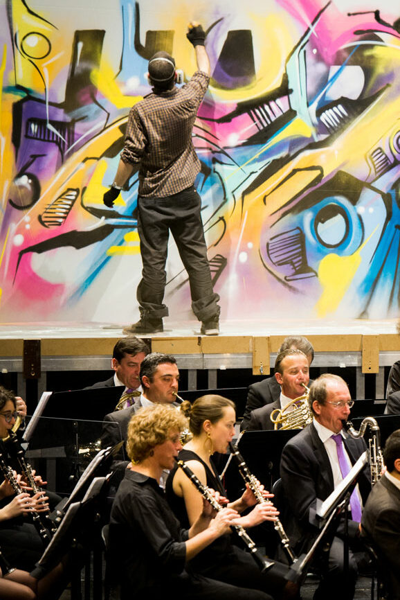 Alex Kanos is painting during Harmonic Orchestra Concert Alex Kanos is painting during Harmonic Orchestra Concert