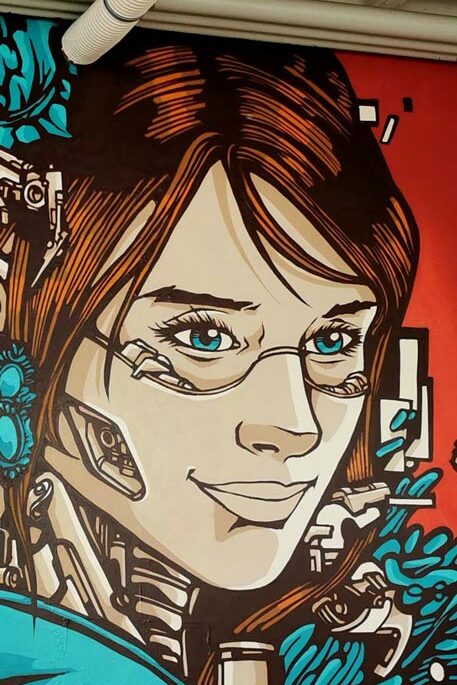 A Street Art Mural paint by Alex Kanos in Geneva close-up of an idoor mural made by alex kanos called clemence in geneva switzerland