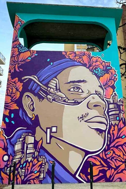 Street Art Argenteuil Lumières mural thumbnail featuring the cyberpunk male portrait by Alex Kanos